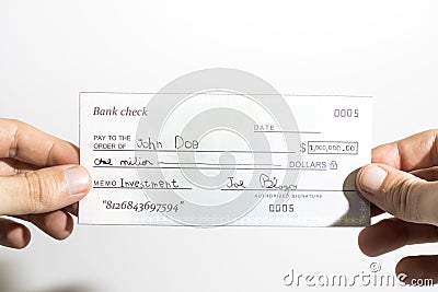 Holding a million dollar bank check isolated in a white background Stock Photo