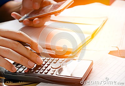 Holding phone,use mobile phone for searching data in office or home Stock Photo