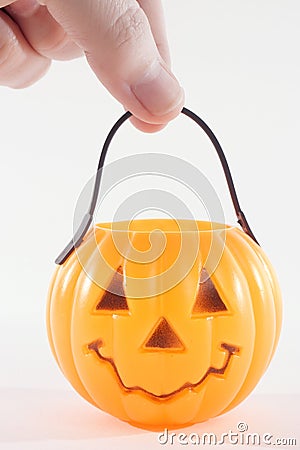 Holding a Plastic Pumpkin Stock Photo