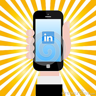 Holding smartphone with Linkedin logo Editorial Stock Photo