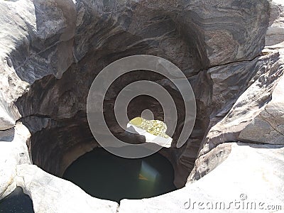 HOLE IN BETWEEN A BIG ROCK Stock Photo