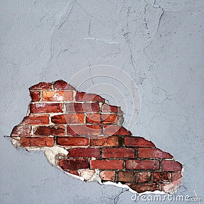 Hole in Concrete gives way to brick Stock Photo