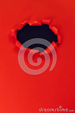 Hole in red paper. frame with a black background for the header. copy space Stock Photo