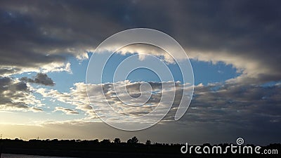 A Hole in the Sky! Cloud Formation called Cavum Stock Photo