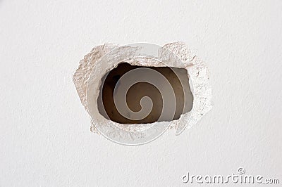 Hole on the wall Stock Photo