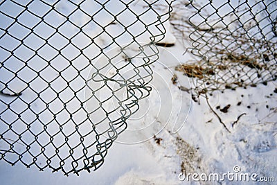 Hole in wire border fence. Stock Photo