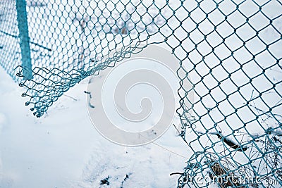 Hole in wire border fence. Stock Photo