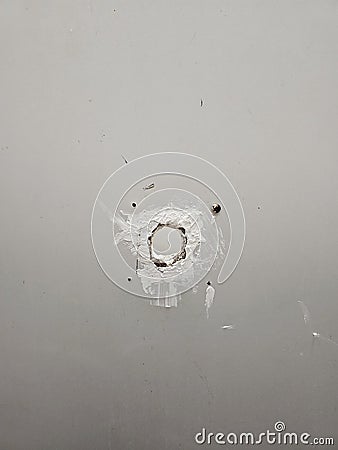 hole on wooden toilet wall Stock Photo