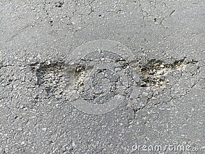 holes in the highway asphalt that endanger motorists Stock Photo