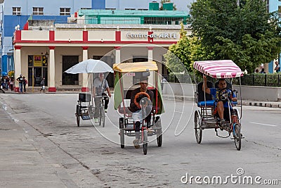 Holguin, Cuba 12/12/2018 Cyclo taxi or rickshaw waiting for passengers Editorial Stock Photo