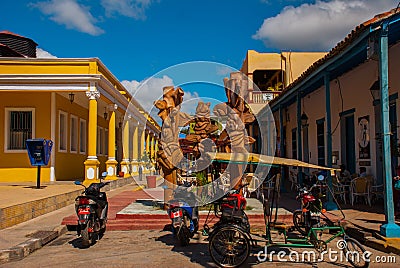 Holguin, Cuba: Motorcycles and bicycles are parked at the monument in the city center Editorial Stock Photo