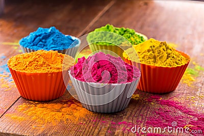 Holi color powder. Organic Gulal colours in bowl for Holi festival, Hindu tradition festive. Bright vibrant pigment Stock Photo