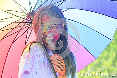 Holi girl with umbrella. children with creative body art. Happy youth party. Optimist. Spring vibes. positive and Stock Photo