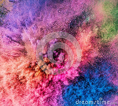 Holi powder bursting up, creating exploding texture. Stock Photo