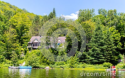 Holiday apartment - wooden cottage in forest Stock Photo