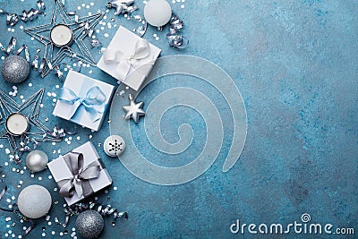 Holiday background with christmas decoration and gift boxes top view. Festive greeting card. Flat lay style. Stock Photo