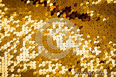 Background from gold glitter paillettes, close up. Metallic Glitter background , Golden sequins, sparkling sequined textile Stock Photo