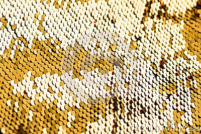 Background from gold glitter paillettes, close up. Metallic Glitter background , Golden sequins, sparkling sequined textile Stock Photo