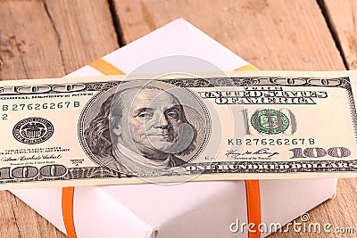 Holiday bonus. american money on green gift box Stock Photo