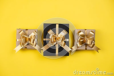 Holiday composition. Various gift boxes on pastel yellow background. Christmas, new year, birthday concept. Stock Photo