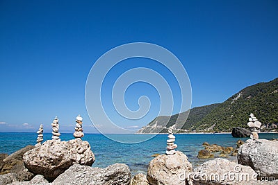 Holiday dreams - blue ocean background with stones. Stock Photo