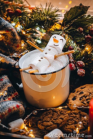 Holiday food white cup with hot chocolate cocoa snowman marshmallows. homemade sweet cookie, cinnamon stick fir xmas tree warm gar Stock Photo