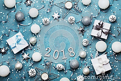 Holiday frame with christmas decoration, gift box, confetti and sequins on vintage blue table top view. Flat lay. New year 2018. Stock Photo