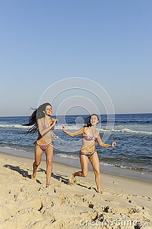 Holiday fun: two girls having a racing duel Stock Photo