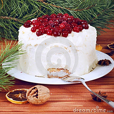 Holiday layered cake with cream and cranberry decoration Stock Photo