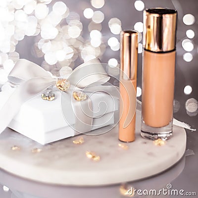 Holiday make-up foundation base, concealer and white gift box, luxury cosmetics present and blank label products for beauty brand Stock Photo