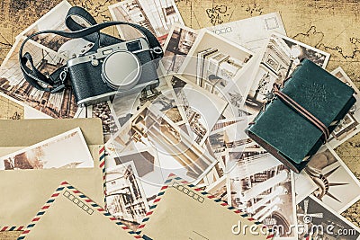 Holiday memories. Vintage postcards with a map, photo camera and travel notebook Stock Photo