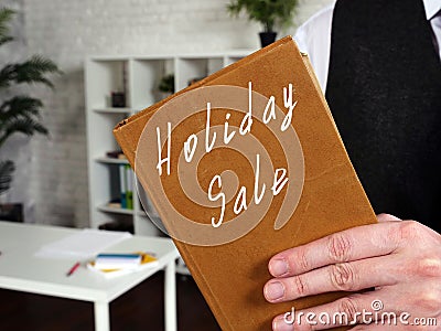 Holiday Sale inscription on the page Stock Photo
