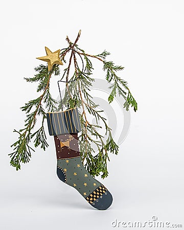 Holiday sock ornament with star and live evergreens Stock Photo