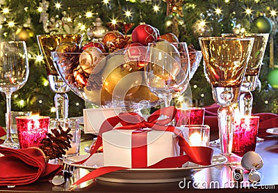 Holiday table setting with red ribbon gift Stock Photo