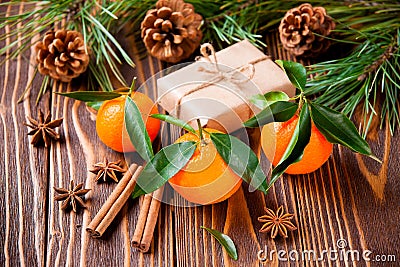 Holiday tangerines with fir branches and cones Stock Photo