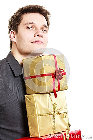 Holiday. Young man giving presents gifts boxes Stock Photo