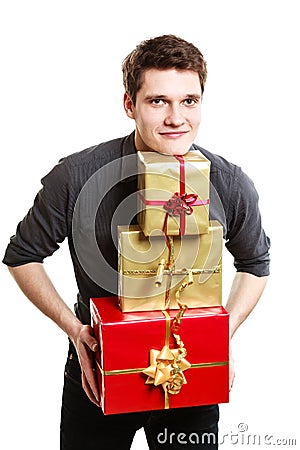 Holiday. Young man giving presents gifts boxes Stock Photo