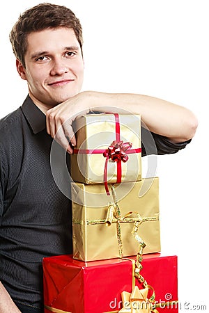 Holiday. Young man giving presents gifts boxes Stock Photo