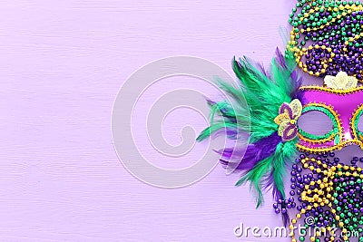 Holidays image of mardi gras masquarade venetian mask over purple background. view from above Stock Photo