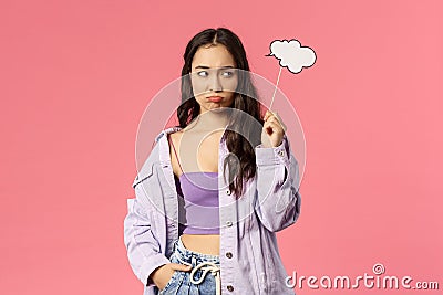 Holidays, lifestyle and people concept. Portrait of gloomy uneasy asian female dont know any idea, sulking and looking Stock Photo