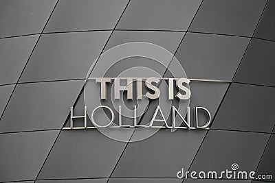 This Is Holland stainless steel signboard. Gray aluminum facade Editorial Stock Photo