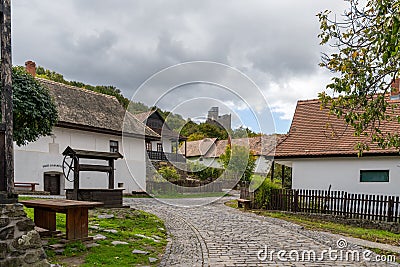 View of the historic village center of Holloko with the 14th-century castle in the background Editorial Stock Photo