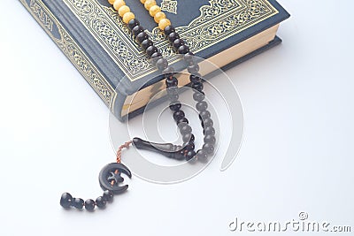 Holly Quran with beads on white background , close up Stock Photo