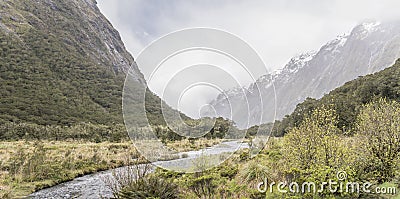 Hollyford river valley near Monkey creek under low clouds, Fiordland Park, New Zealand Stock Photo