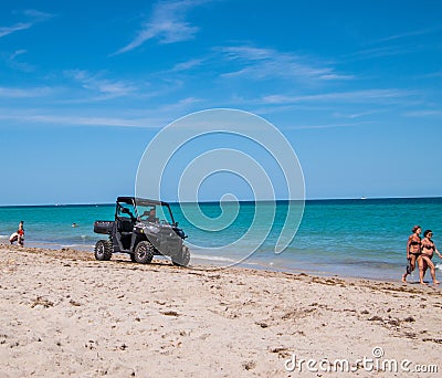 Hollywood Police in four wheel drive vehicle patrolling beach Editorial Stock Photo