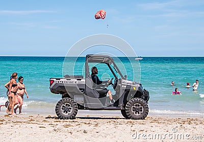 Hollywood Police in four wheel drive vehicle patrolling beach Editorial Stock Photo