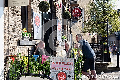 People meeting friends at coffee shop Editorial Stock Photo