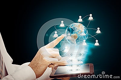 The hologram of the earth tablet. New technologies of communication between people. Business development Stock Photo