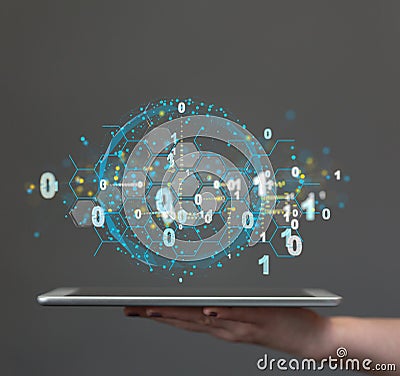 Hologram of a small sphere with binary numbers hovering over a hand with a tablet. Stock Photo