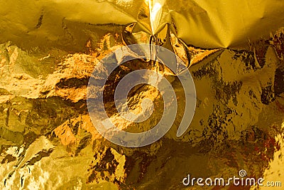 Holographic real gold texture in trendy colors with scratches and irregularities. Holographic color wrinkled foil. Holographic Stock Photo